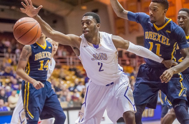 (2/18/15) - (Harrisonburg)  James Madison guard Ron Curry (2) reaches out for a loose ball during the first half of an NCAA basketball game between James Madison University and Drexel University in Harrisonburg, Va., Feb. 18, 2015.  (Daily News-Record/Daniel Lin)