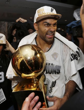 San Antonio Spurs guard Tony Parker celebrates in the locker room after Game 5 of the NBA basketball finals against the Miami Heat on Sunday, June 15, 2014, in San Antonio. The Spurs won the NBA championship 104-87. (AP Photo/David J. Phillip)